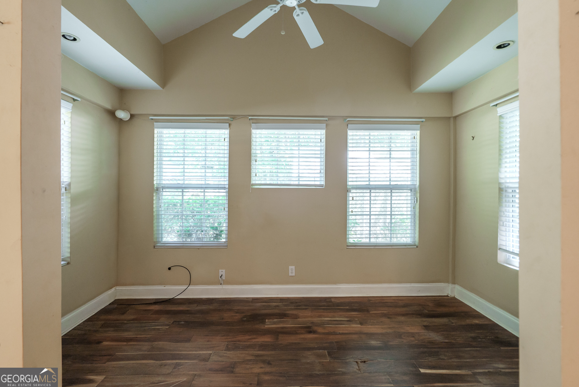 1491 Swords Trail Buckhead, GA 30625 - Photo 14 of 52 a view of an empty room with wooden floor and a window