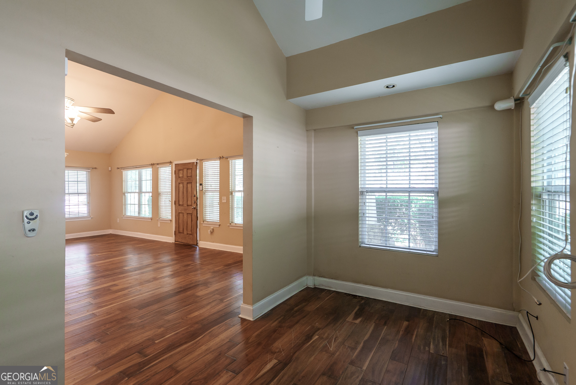 1491 Swords Trail Buckhead, GA 30625 - Photo 16 of 52 a view of an empty room with wooden floor and a window