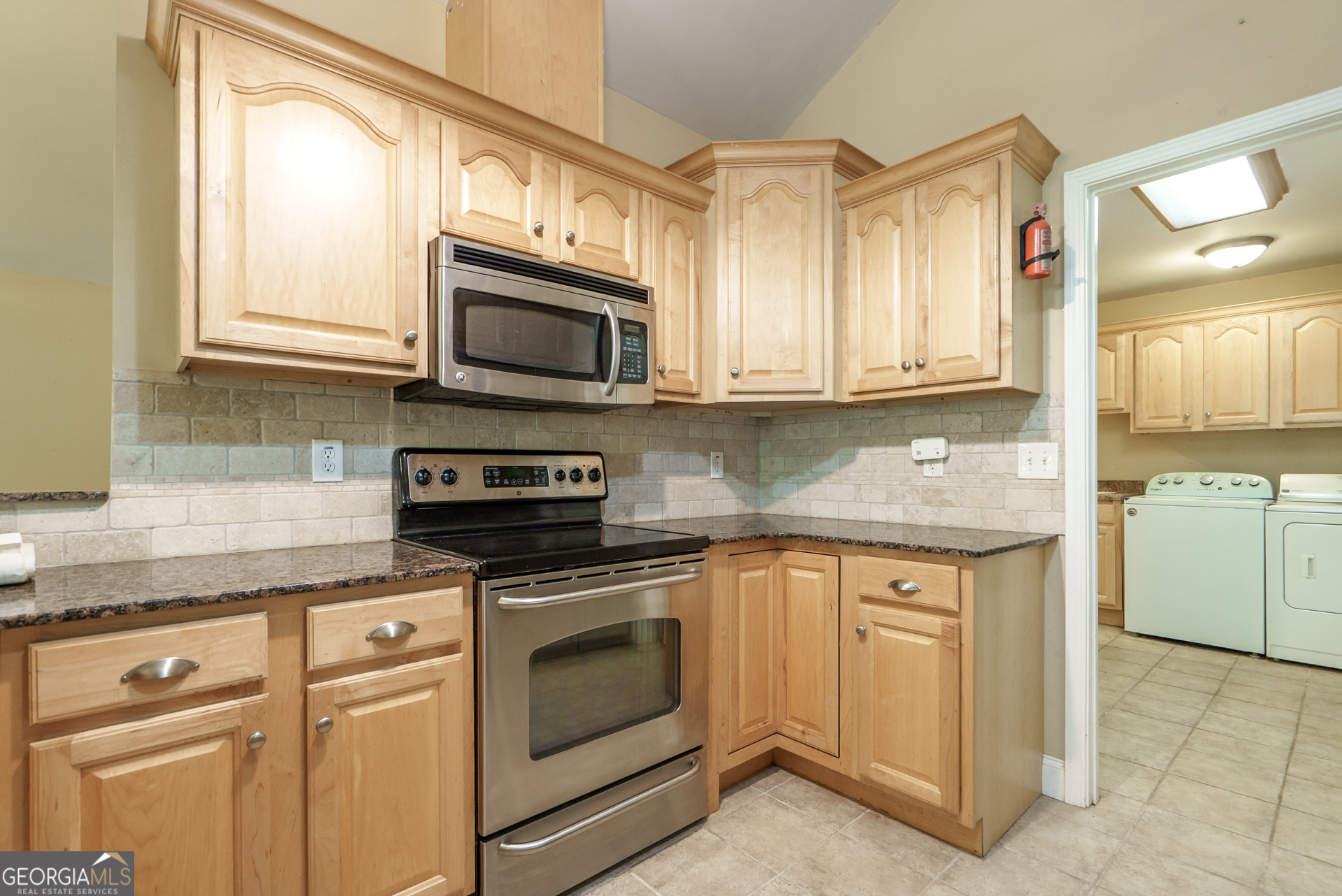 1491 Swords Trail Buckhead, GA 30625 - Photo 20 of 52 a kitchen with granite countertop cabinets stainless steel appliances and a sink