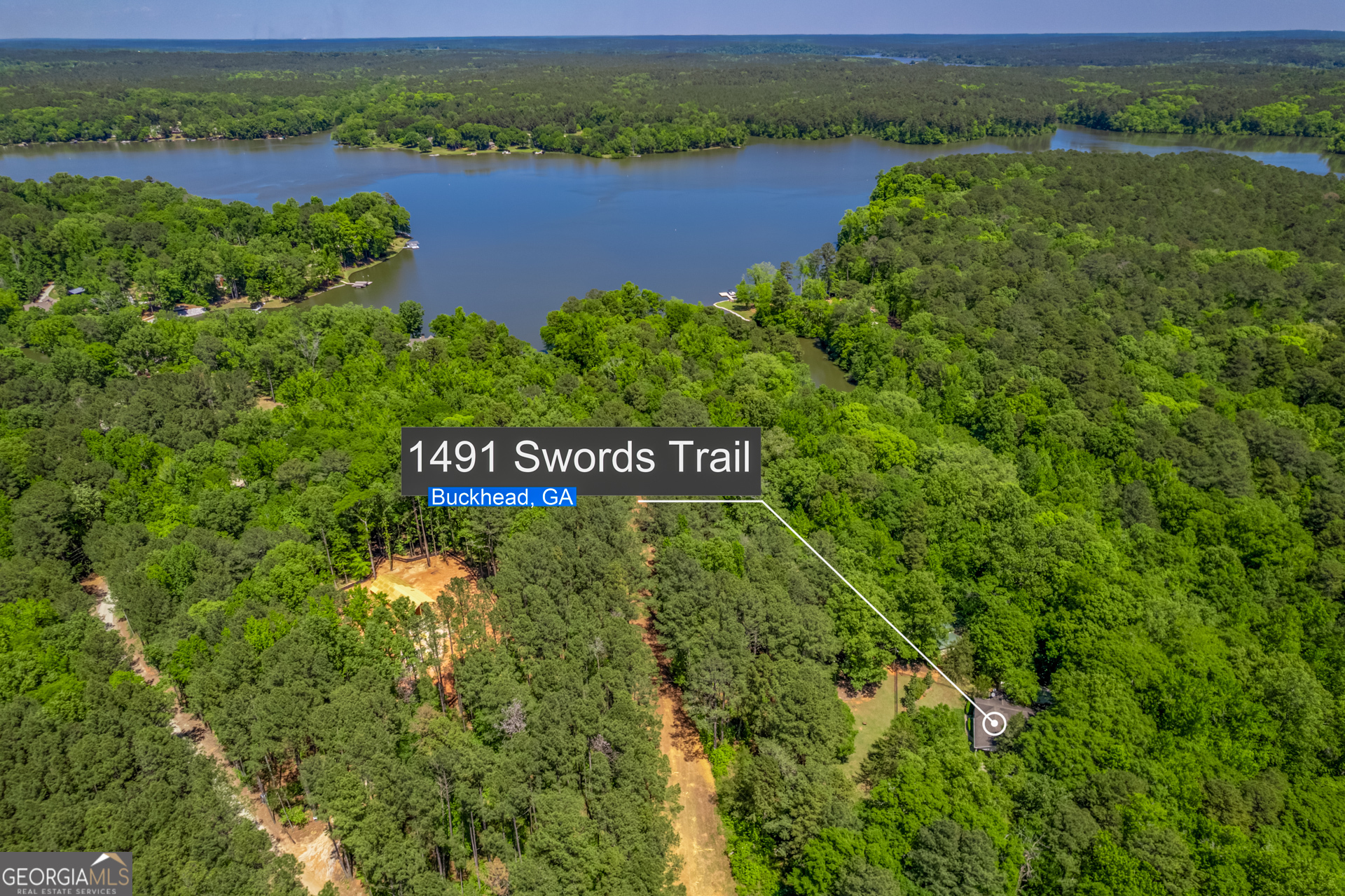 1491 Swords Trail Buckhead, GA 30625 - Photo 2 of 52 a view of a lake with houses