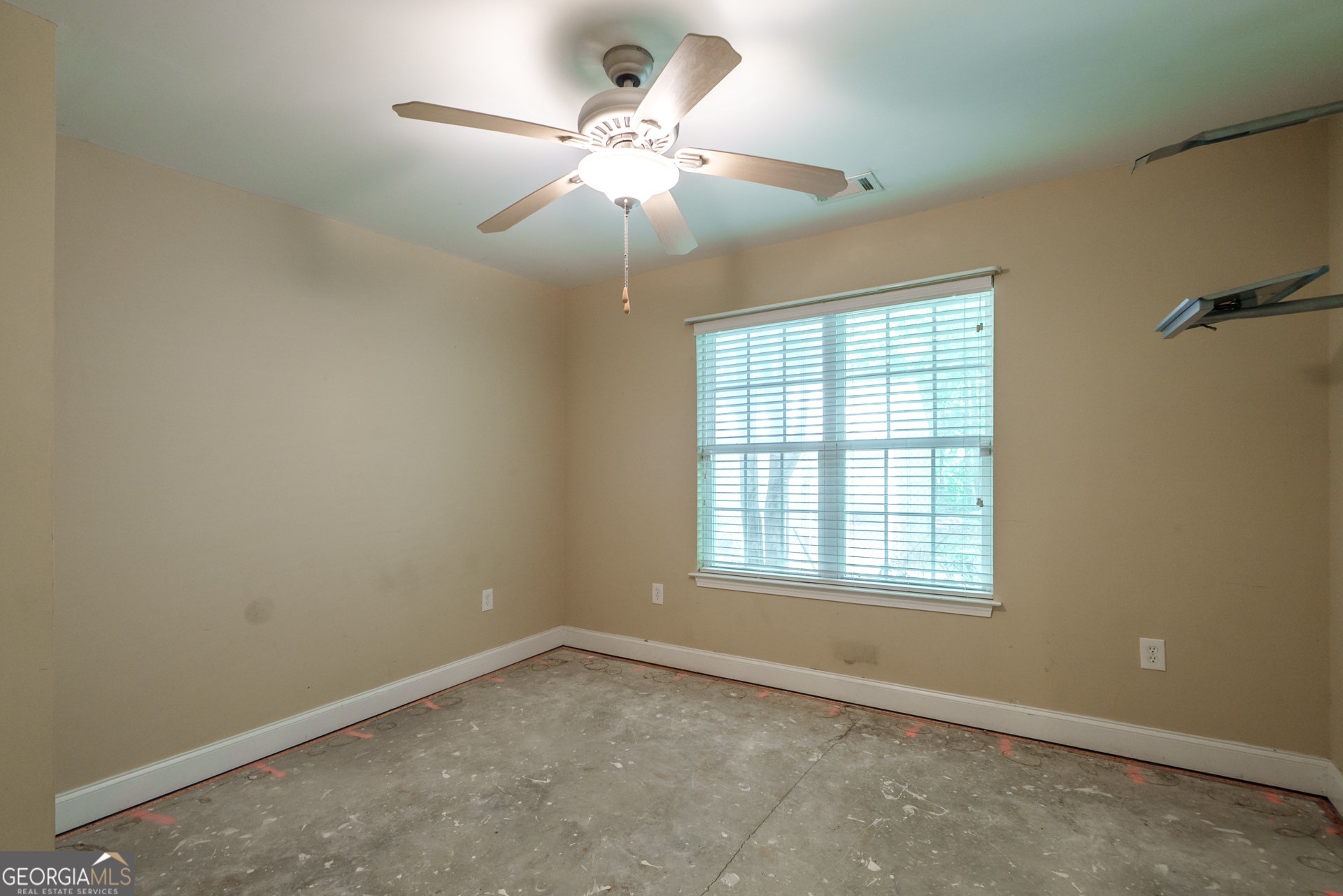 1491 Swords Trail Buckhead, GA 30625 - Photo 24 of 52 an empty room with chandelier fan and windows