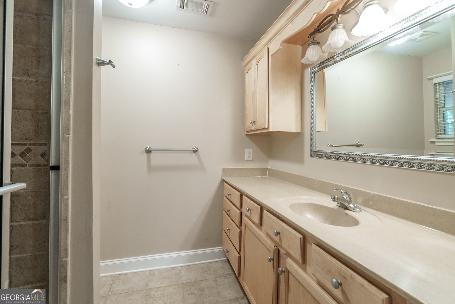 1491 Swords Trail Buckhead, GA 30625 - Photo 30 of 52 a bathroom with a sink and a mirror