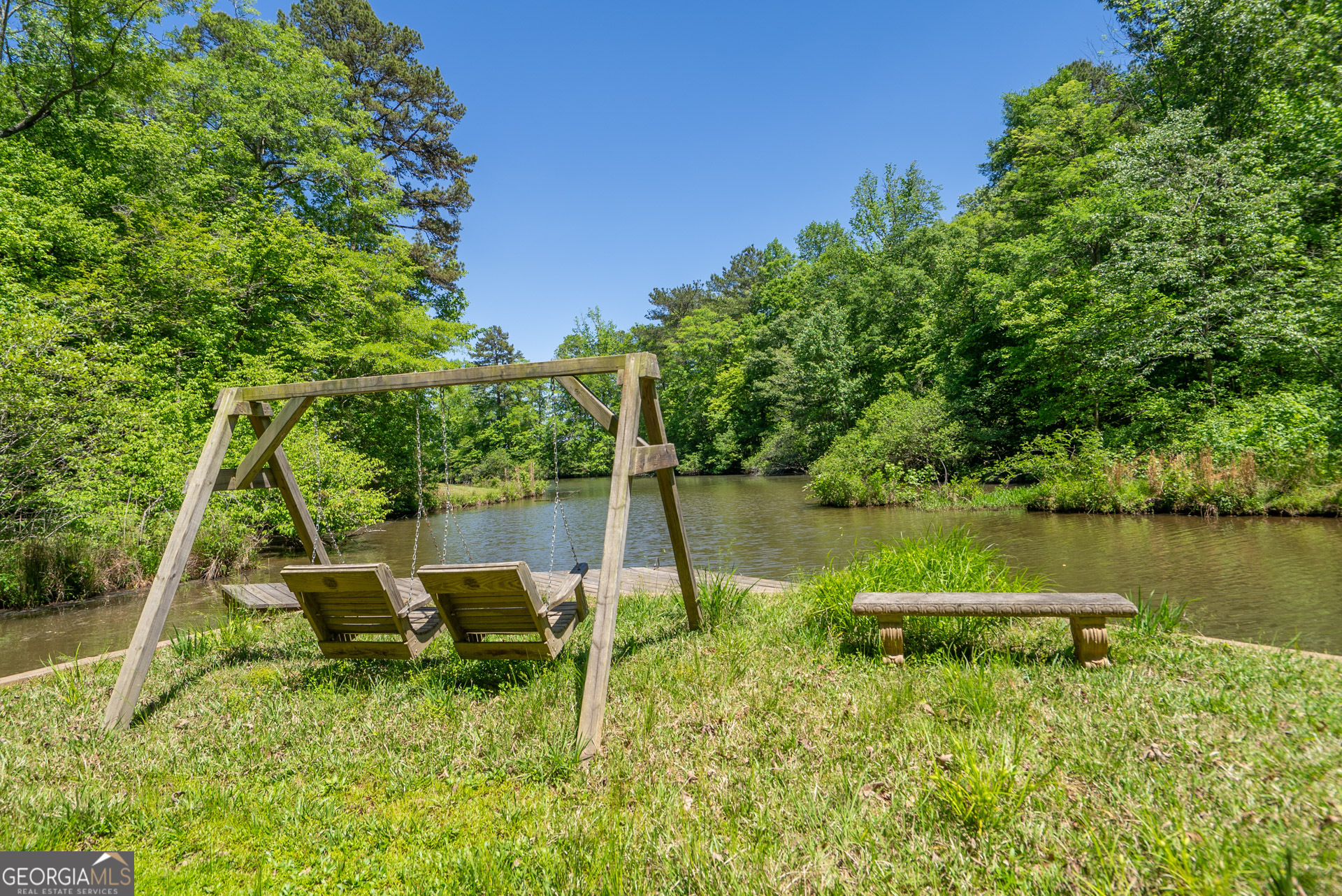 1491 Swords Trail Buckhead, GA 30625 - Photo 3 of 52 a backyard of a house with table and chairs