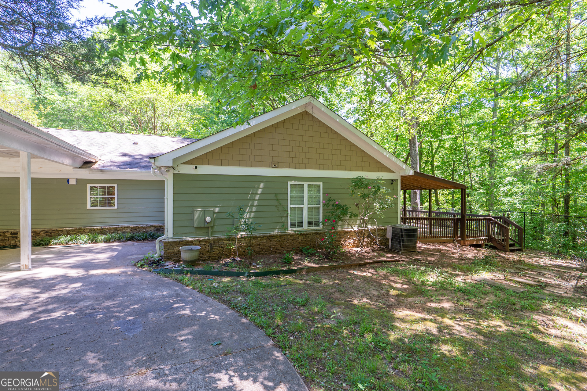 1491 Swords Trail Buckhead, GA 30625 - Photo 41 of 52 a front view of a house with a garden and outdoor seating