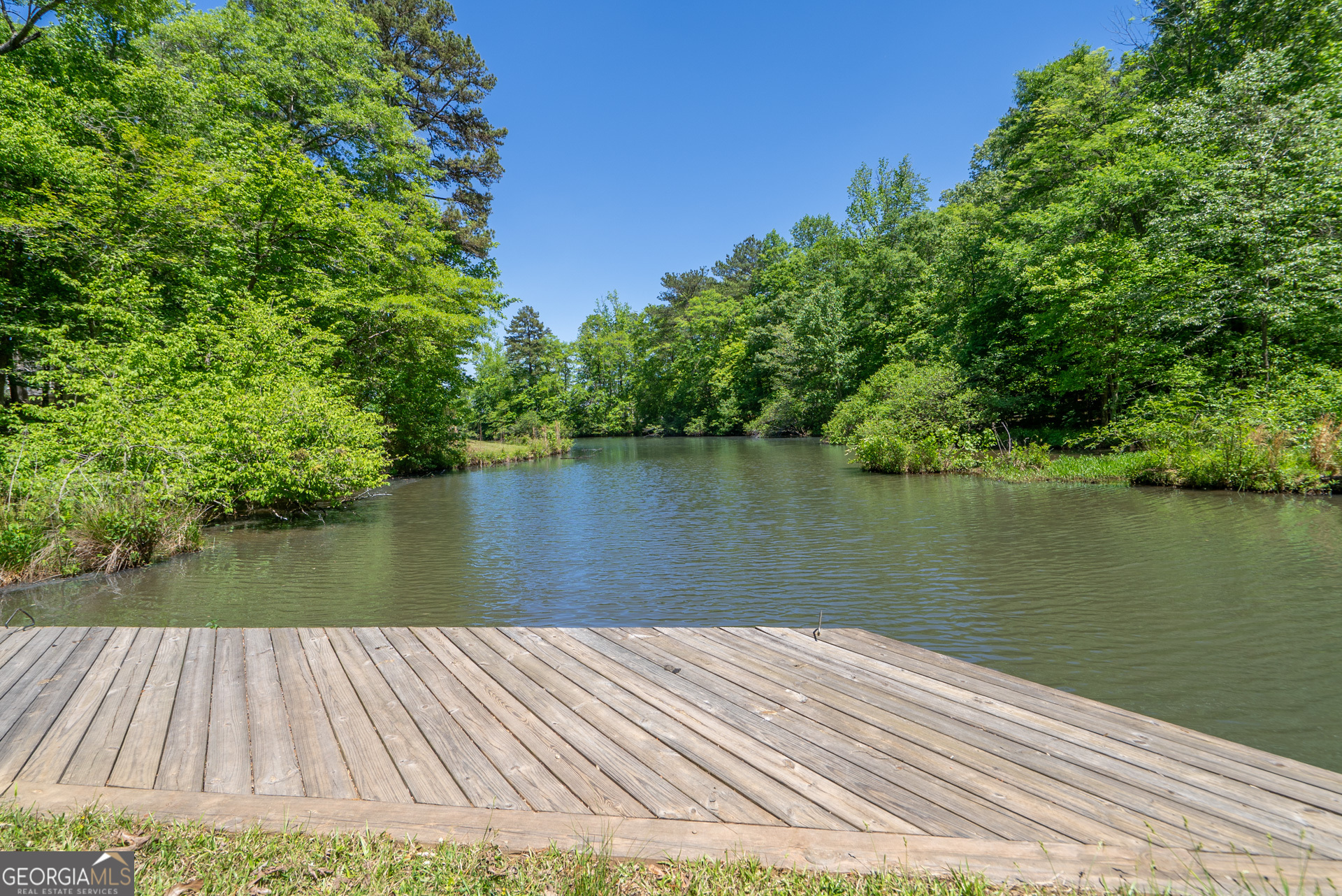 1491 Swords Trail Buckhead, GA 30625 - Photo 49 of 52 a wooden pier with boats in a lake