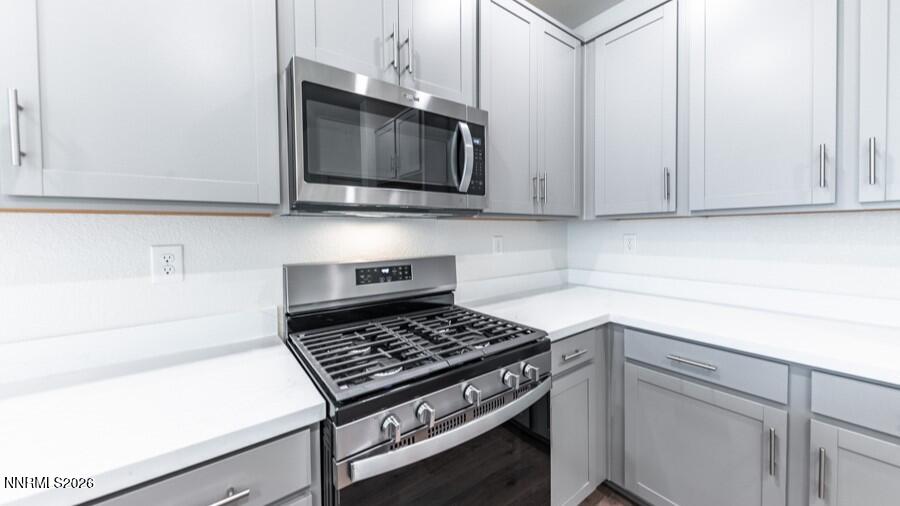 500 Daisy Fay Way Carson City, NV 89705 - Photo 7 of 22 a kitchen with a stove and a microwave
