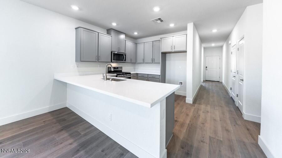 500 Daisy Fay Way Carson City, NV 89705 - Photo 8 of 22 a view of a kitchen cabinets a sink and wooden floor