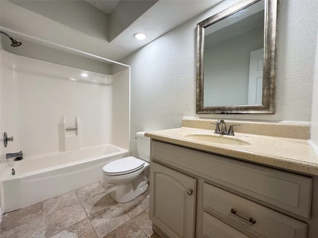 a bathroom with a sink a toilet and a bathtub