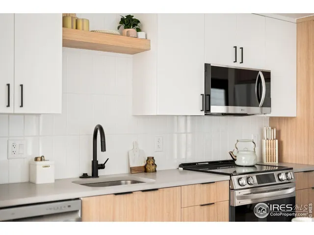 a view of a room with a table and chairs