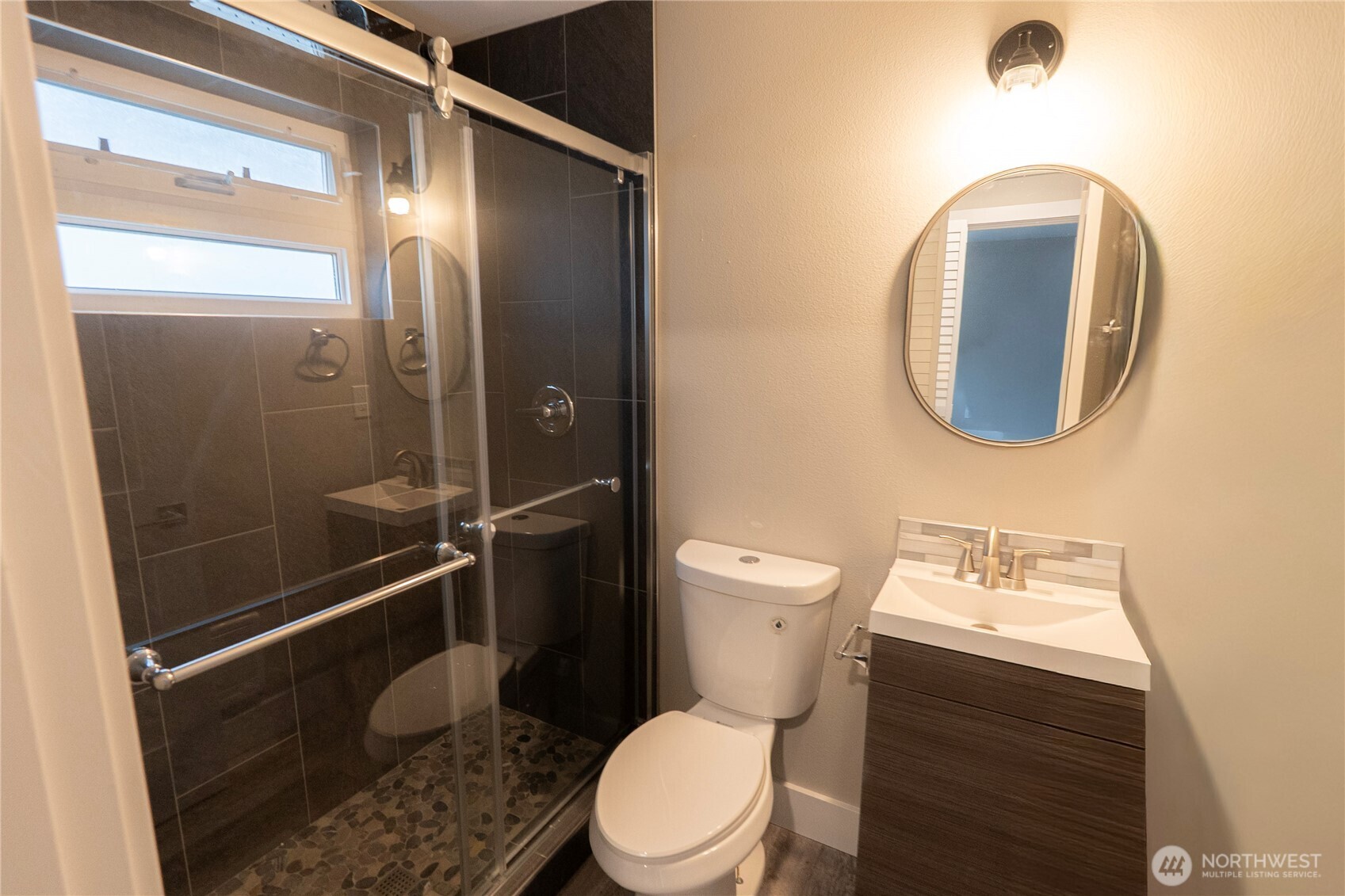 3035 64th Avenue Southwest Seattle, WA 98116 - Photo 11 of 14 a bathroom with a toilet sink and shower