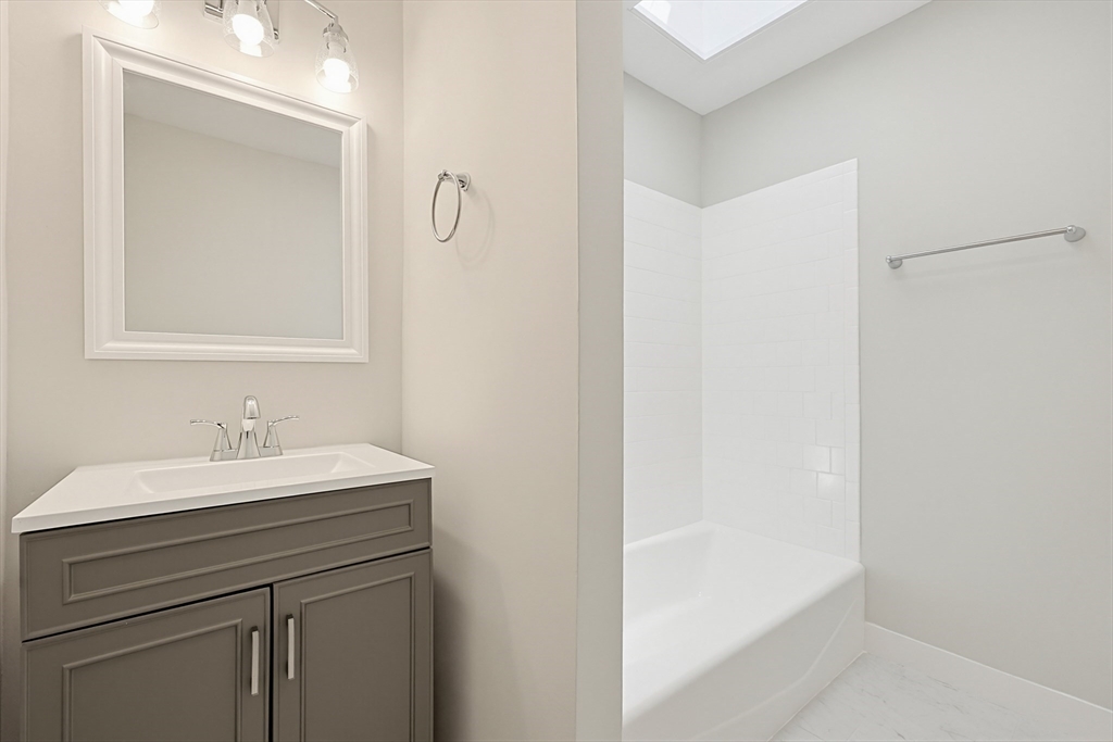 10 Water Street Natick, MA 01760 - Photo 24 of 35 a bathroom with a sink and a mirror