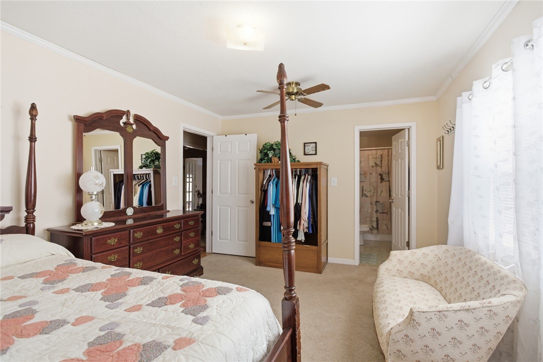 108 Hodge Street Abbeville, SC 29620 - Photo 22 of 39 A well-lit bedroom provides comfortable living with plush carpeting and traditional accents.