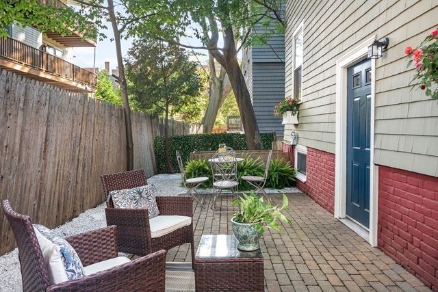 a view of a patio with furniture