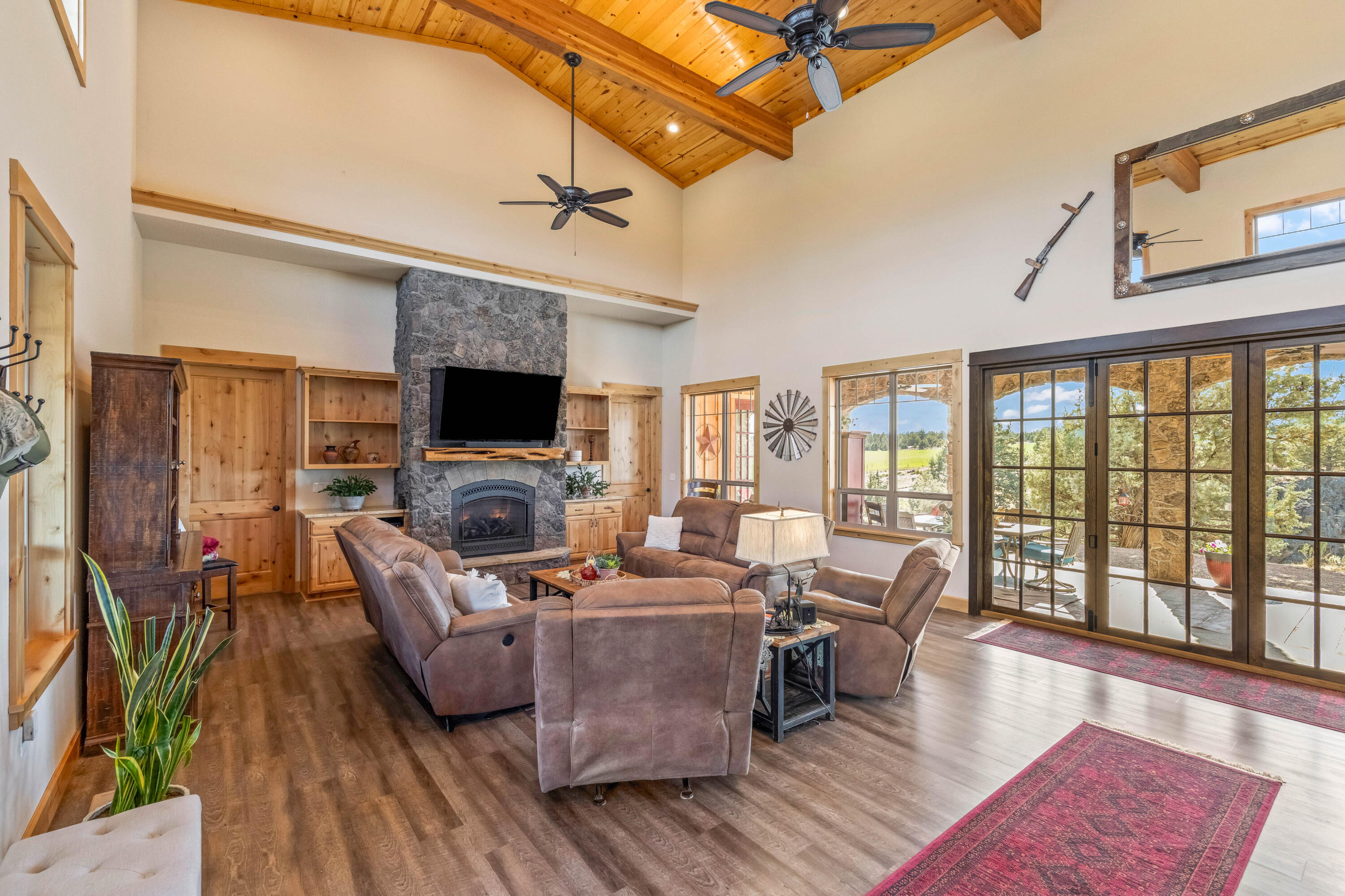 70030 Northwest Hunt Road Sisters, OR 97759 - Photo 5 of 55 a living room with fireplace furniture and a flat screen tv