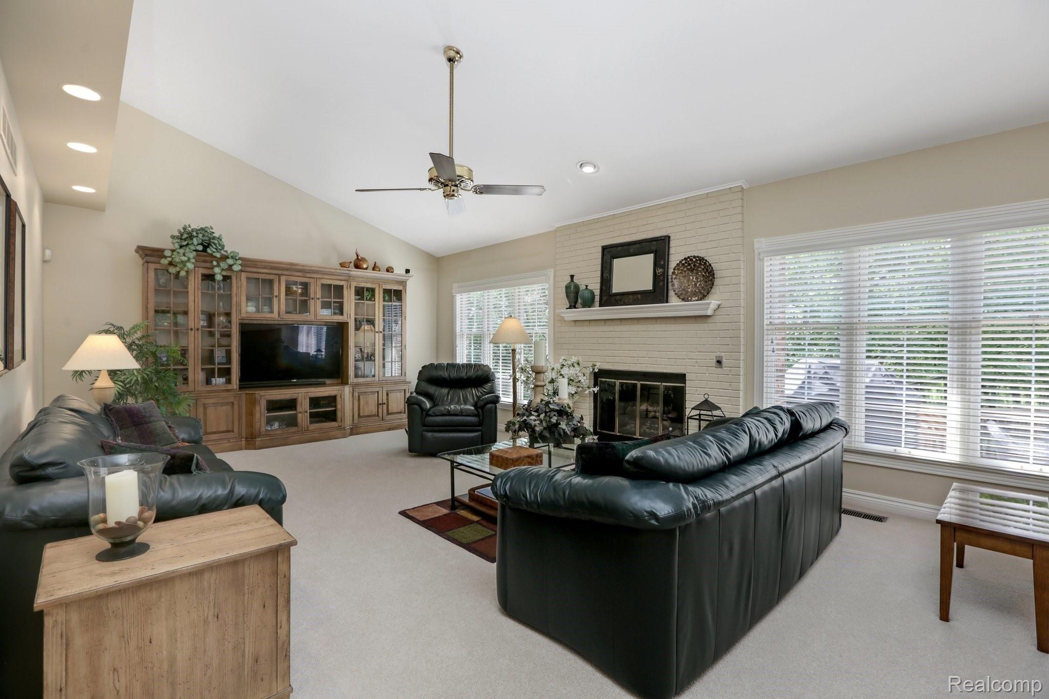 4808 Rivers Edge Drive Troy, MI 48098 - Photo 15 of 40 Large great room with high ceilings and fireplace