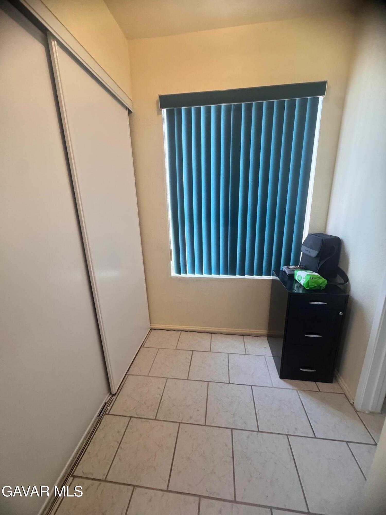 2309 Gregory Avenue Palmdale, CA 93550 - Photo 11 of 29 a view of an empty room with a window