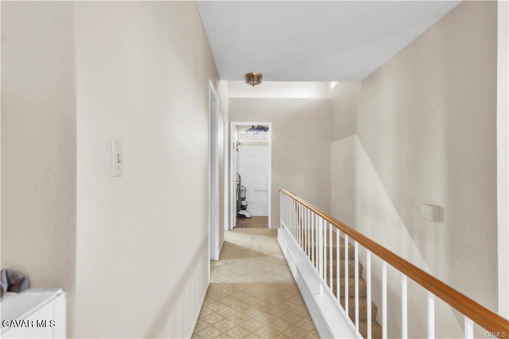 2309 Gregory Avenue Palmdale, CA 93550 - Photo 13 of 29 a view of a hallway with wooden floor and entryway