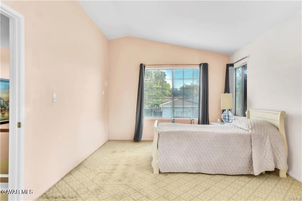 2309 Gregory Avenue Palmdale, CA 93550 - Photo 18 of 29 a living room with a couch and a table