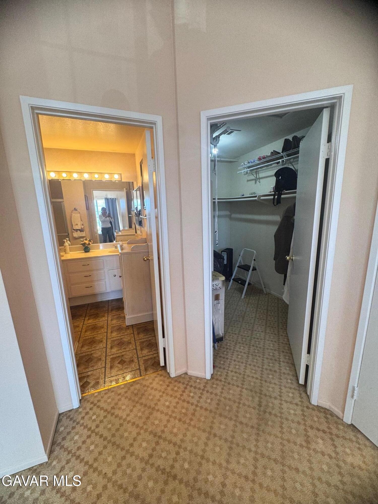 2309 Gregory Avenue Palmdale, CA 93550 - Photo 19 of 29 a view of a hallway and a livingroom with furniture