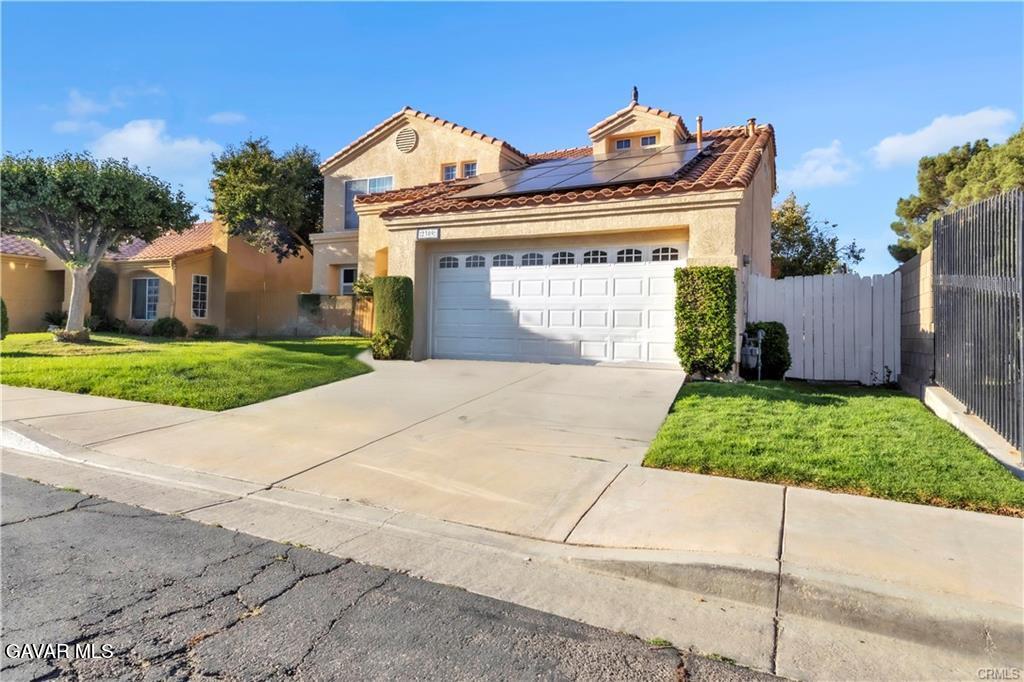 2309 Gregory Avenue Palmdale, CA 93550 - Photo 2 of 29 a view of a house with a yard and plants