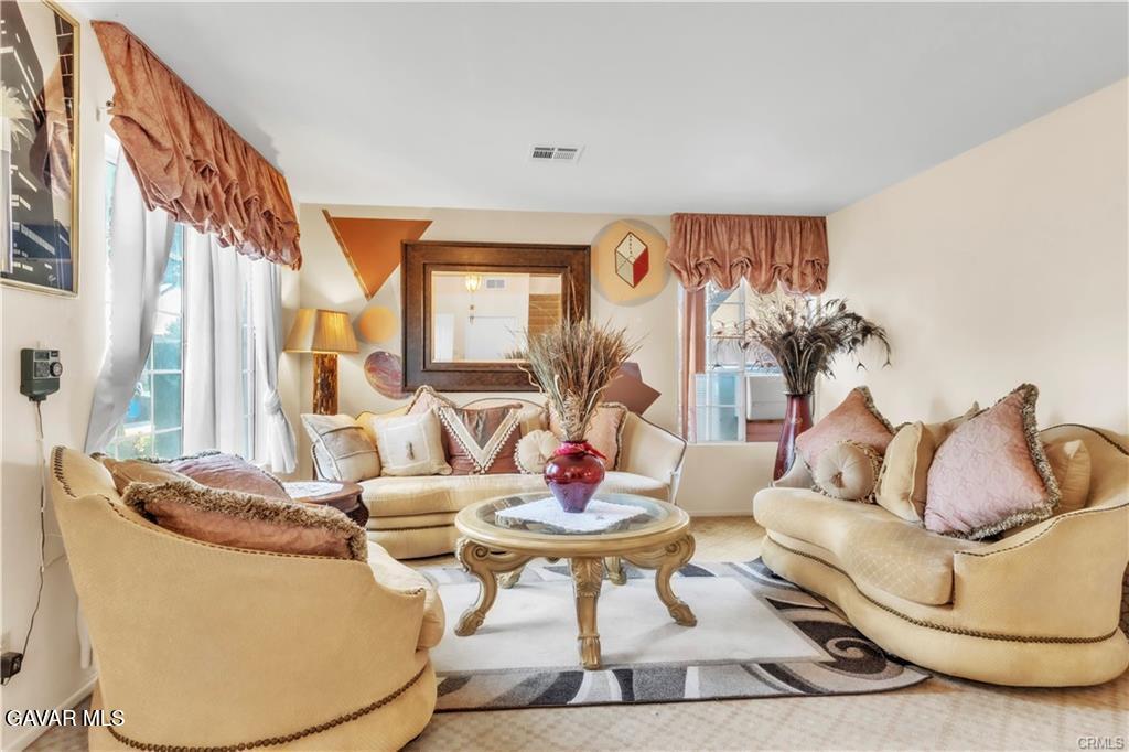 2309 Gregory Avenue Palmdale, CA 93550 - Photo 4 of 29 a living room with furniture and a large window