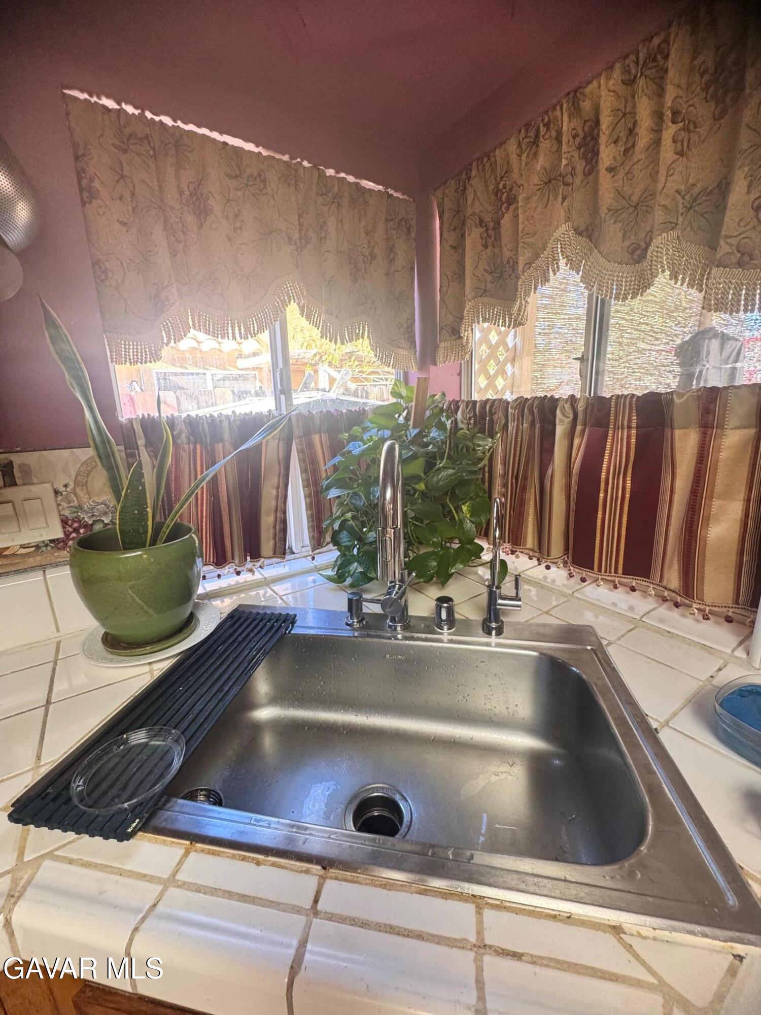 2309 Gregory Avenue Palmdale, CA 93550 - Photo 6 of 29 a view of kitchen sink and living tub