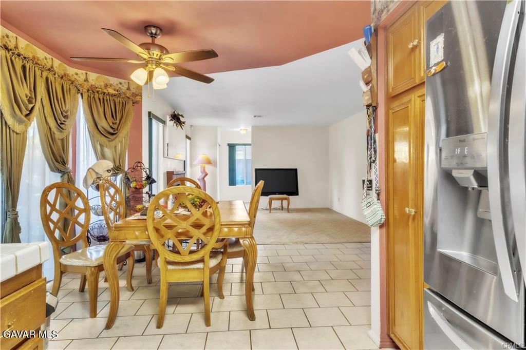 2309 Gregory Avenue Palmdale, CA 93550 - Photo 7 of 29 a view of a dining area with chandelier