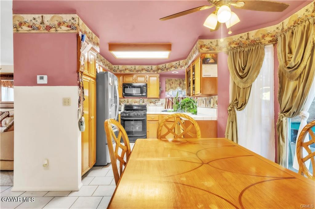 2309 Gregory Avenue Palmdale, CA 93550 - Photo 8 of 29 a bed room with a bed and a chandelier