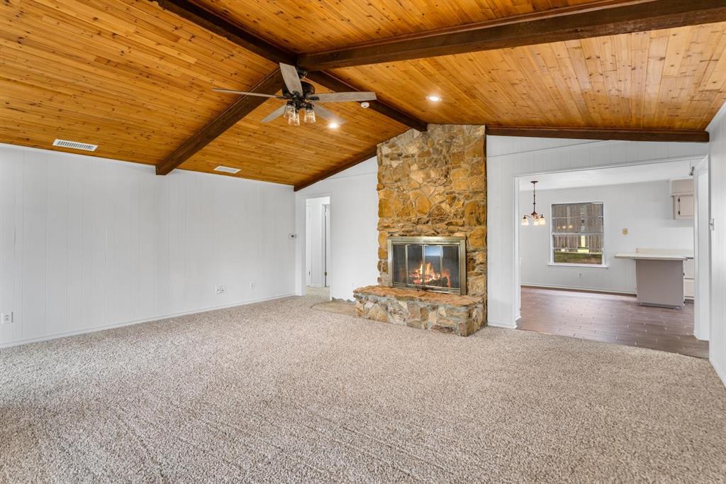 525 Pecan Lane Rowlett, TX 75089 - Photo 11 of 23 a view of a livingroom with wooden floor and a ceiling fan