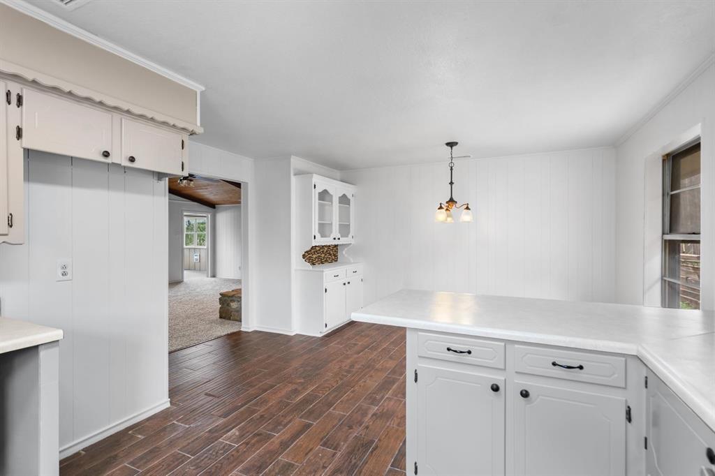525 Pecan Lane Rowlett, TX 75089 - Photo 16 of 23 a view of a kitchen with cabinets and wooden floor