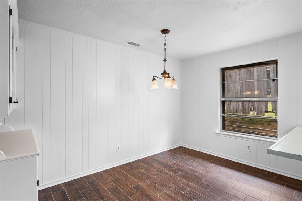 525 Pecan Lane Rowlett, TX 75089 - Photo 17 of 23 a view of empty room with wooden floor and fan