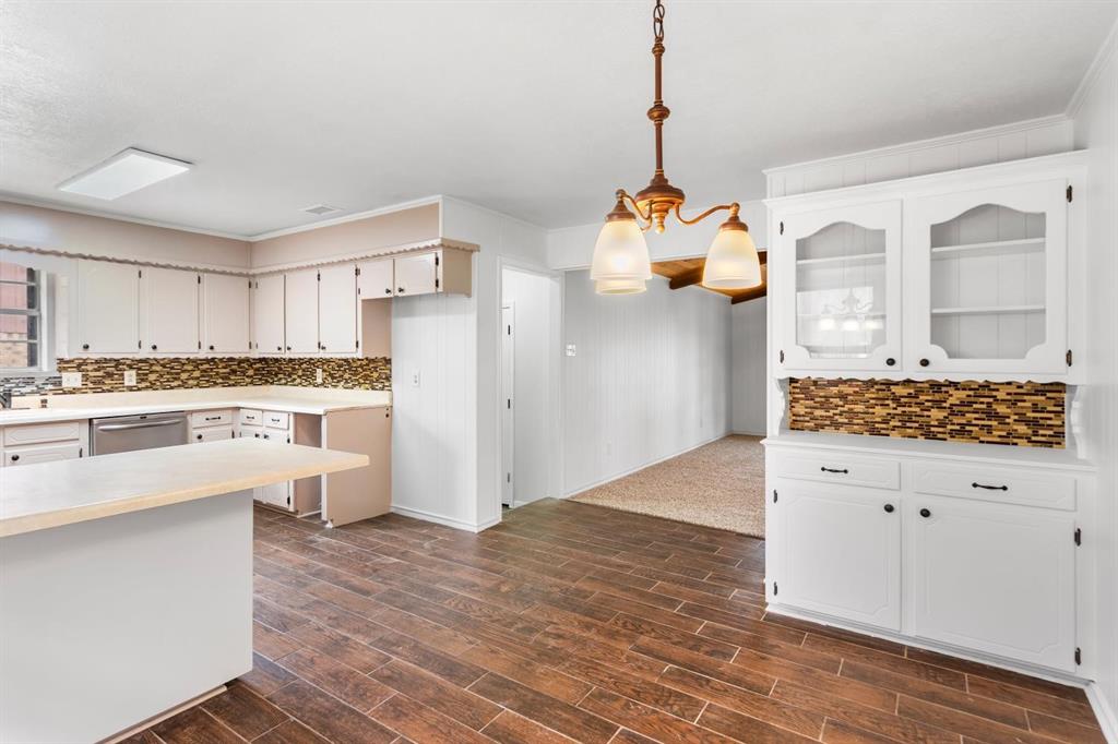 525 Pecan Lane Rowlett, TX 75089 - Photo 18 of 23 a kitchen with stainless steel appliances granite countertop a stove and refrigerator