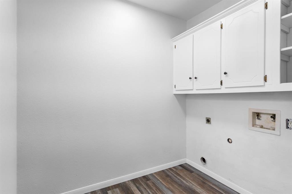 525 Pecan Lane Rowlett, TX 75089 - Photo 23 of 23 a view of cabinets and wooden floor