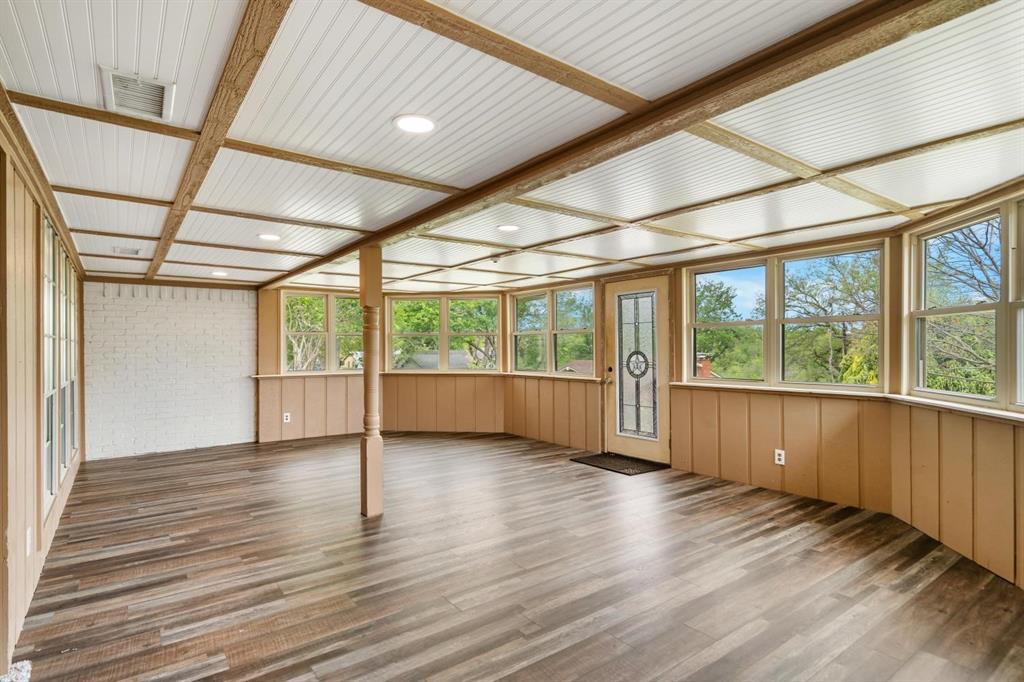 525 Pecan Lane Rowlett, TX 75089 - Photo 9 of 23 an empty room with wooden floor and windows