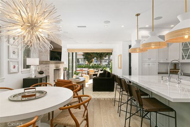 a kitchen with kitchen island granite countertop a sink and a stove