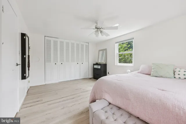 a bedroom with a large bed and a window