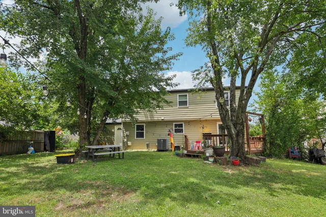 a view of a house with a yard porch and sitting area