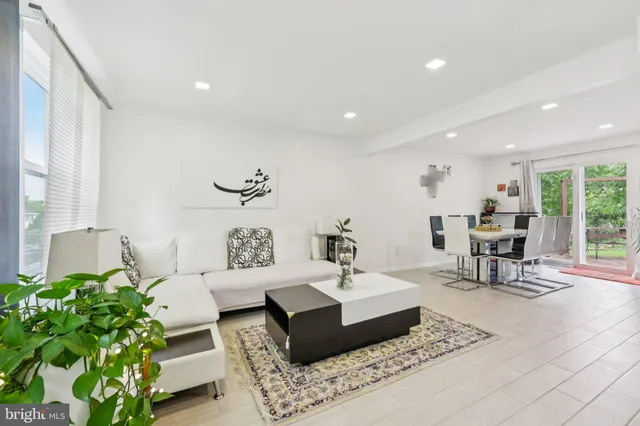 a living room with furniture and a table