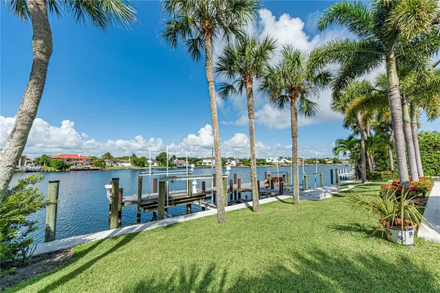 a view of a swimming pool with a table and chairs