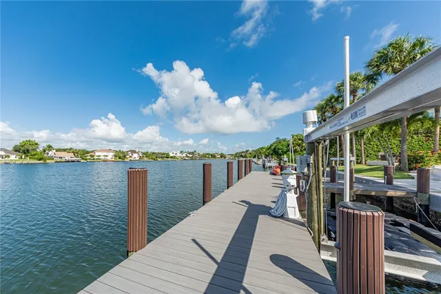 a view of a balcony with wooden floor