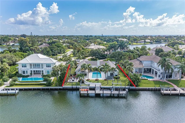 a view of multiple houses with yard