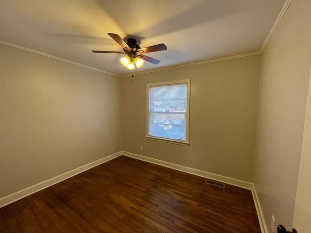1619 Gilson Road Memphis, TN 38117 - Photo 15 of 20 a view of an empty room with a window and wooden floor