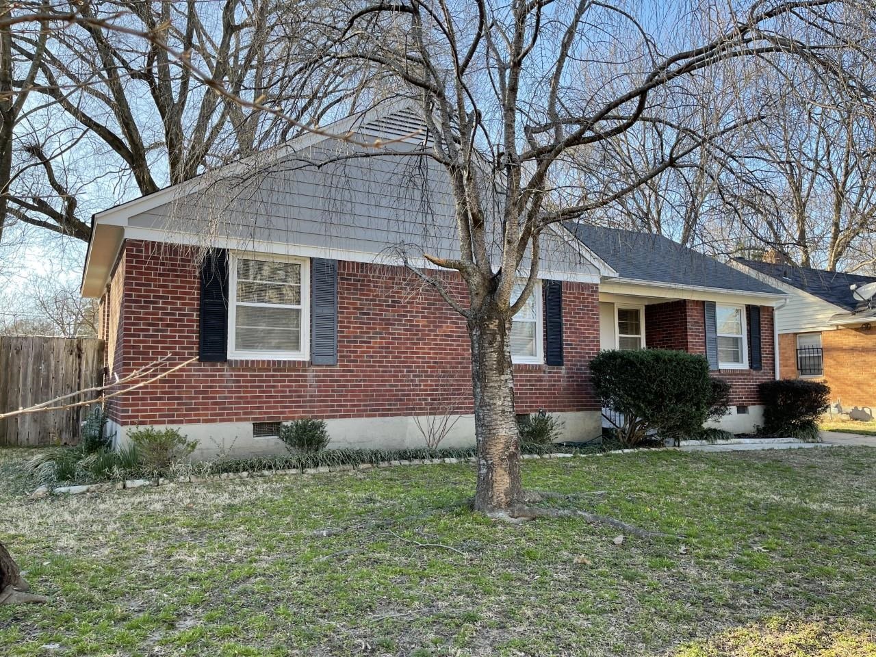 1619 Gilson Road Memphis, TN 38117 - Photo 20 of 20 a front view of a house with a yard and green space