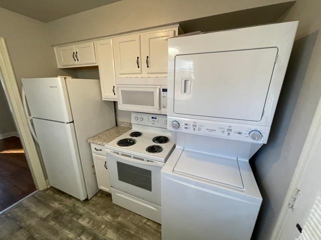 1619 Gilson Road Memphis, TN 38117 - Photo 9 of 20 a white refrigerator freezer and a stove sitting inside of a kitchen