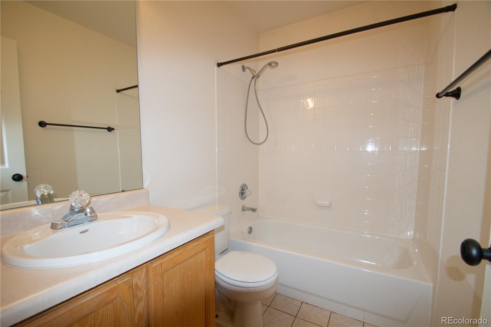 9608 South Castle Ridge Circle Highlands Ranch, CO 80129 - Photo 8 of 33 a bathroom with a sink toilet and shower