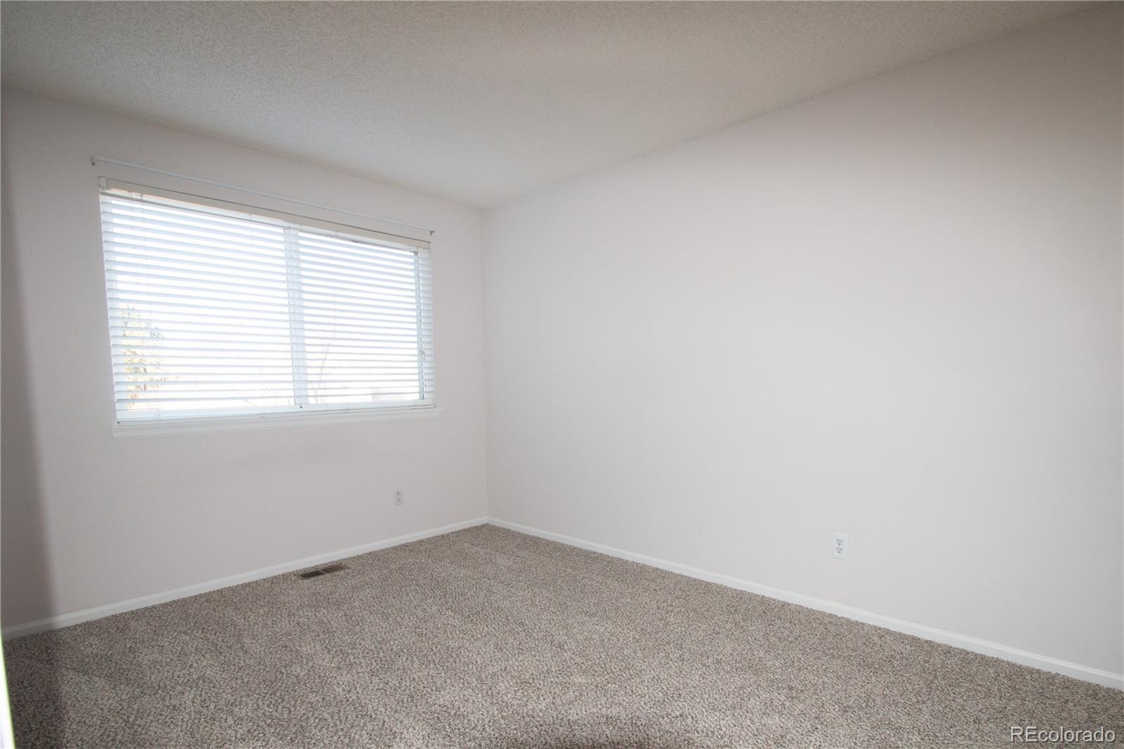 9608 South Castle Ridge Circle Highlands Ranch, CO 80129 - Photo 10 of 33 an empty room with a window