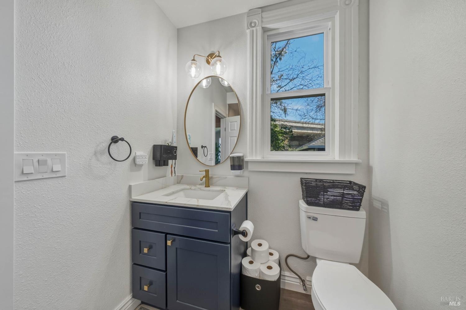 107 Sebastopol Avenue Santa Rosa, CA 95407 - Photo 16 of 33 a bathroom with a toilet a sink and mirror