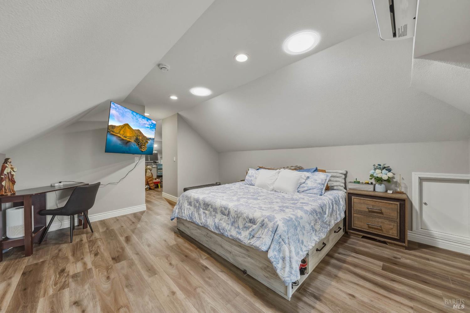 107 Sebastopol Avenue Santa Rosa, CA 95407 - Photo 24 of 33 a bedroom with a bed and a table