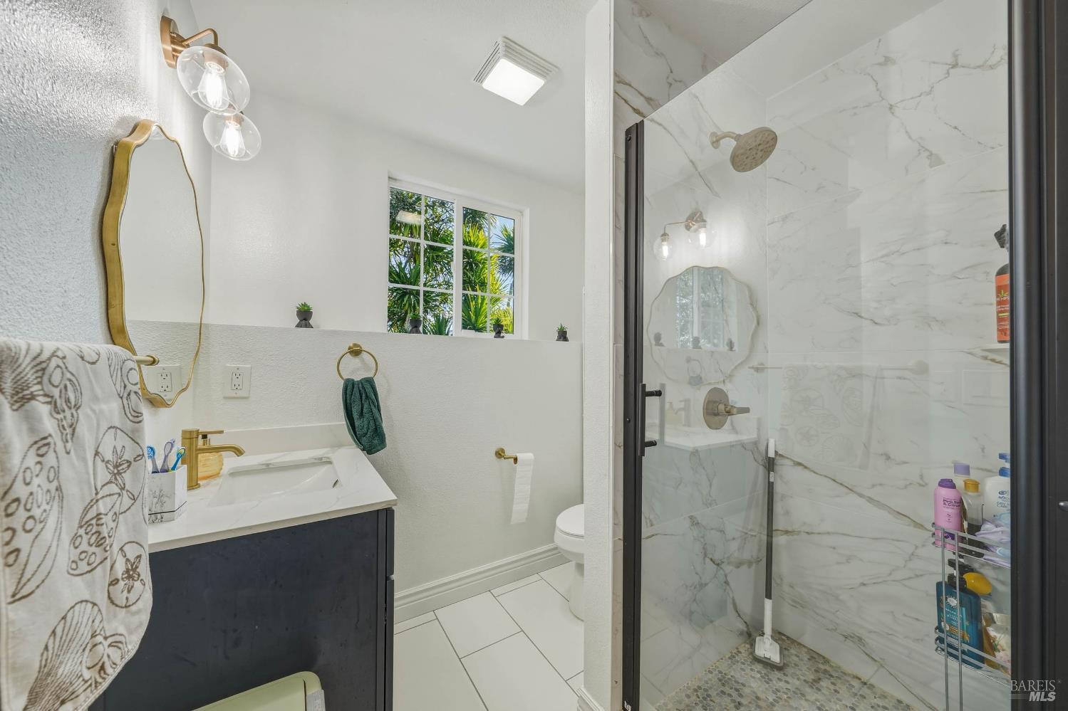 107 Sebastopol Avenue Santa Rosa, CA 95407 - Photo 28 of 33 a bathroom with a sink mirror and shower