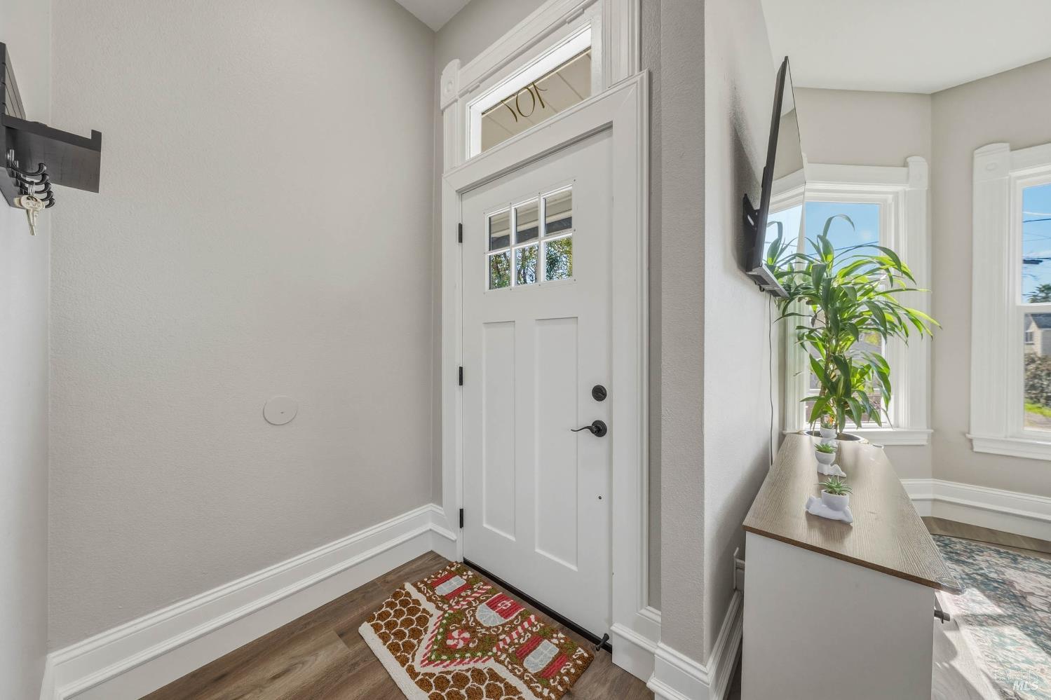 107 Sebastopol Avenue Santa Rosa, CA 95407 - Photo 5 of 33 a view of an entryway with wooden floor